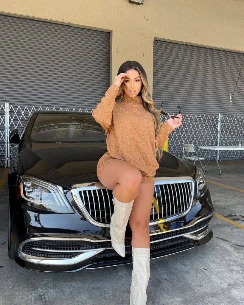 Stephanie Rao Fashion Nova Model standing above the car 